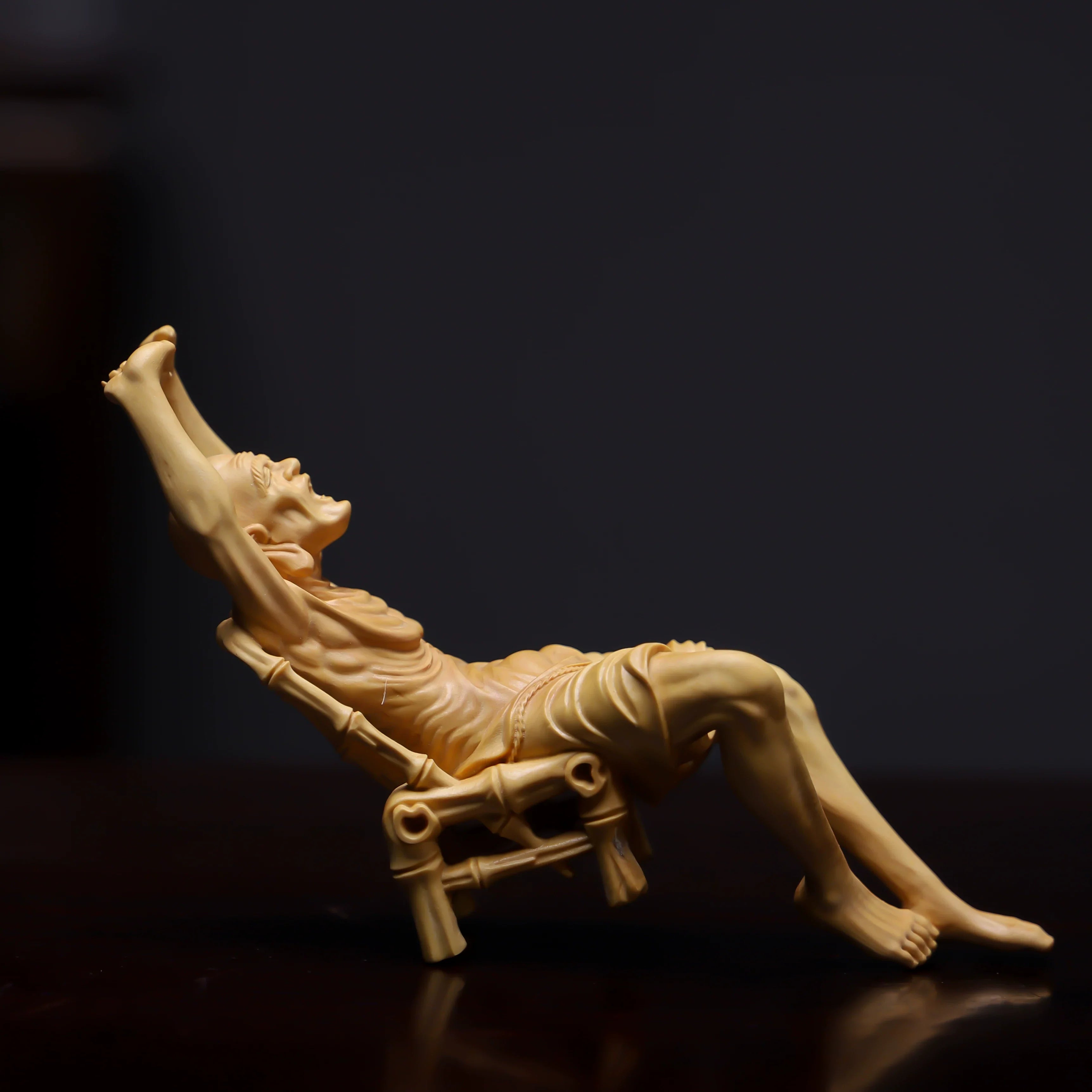 Hand-Carved Reclining Monk Sculpture – Natural Boxwood Wood Statue for Home Decor